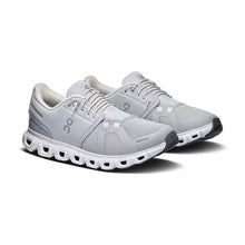 Gray athletic shoes with white sole