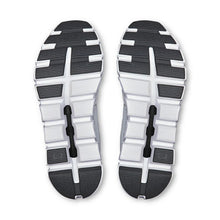 Top view of sole of pair of white and black athletic shoes 