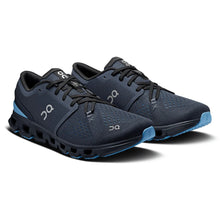 Pair of men's dark blue running gym shoes with blue soles