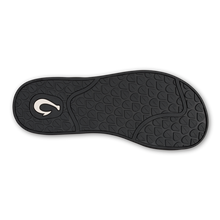 Black shoe sole with a OluKai logo
