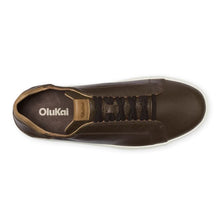 A dark brown leather sneaker by OluKai, featuring dark brown laces, a dark interior lining, and a rubber sole