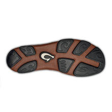 Brown shoe sole with black tread pattern 