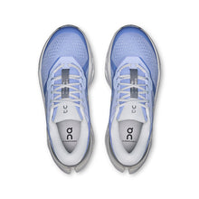 Pair of women's blue running shoes with white soles 