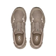 Pair of women's beige athletic sneakers