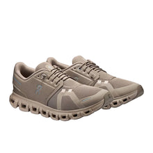 Pair of women's beige running shoes 