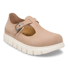 Beige shoe with a buckle on a white background