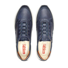 Pair of navy blue sneakers with white soles