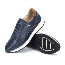 Navy blue casual leather shoe with white sole