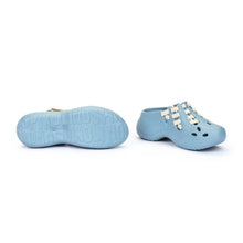 Pair of light blue women's shoes with white laces
