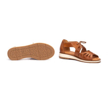 Brown sandal with white sole