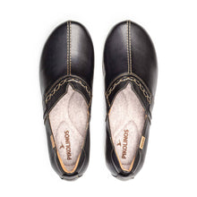 Pair of black leather clogs with light stitching