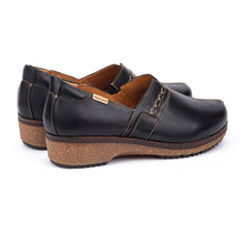 Pair of black leather clogs with cork soles
