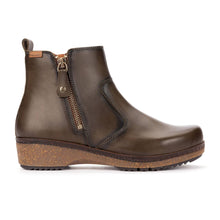 A dark olive leather ankle boot with a side zipper and a wedge heel made of brown cork
