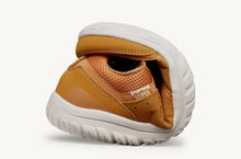 Lems Primal Zen minimalist shoe in Nugget orange example of flexibility.  