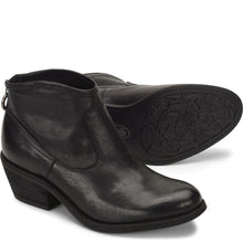 A pair of women's black leather ankle boots