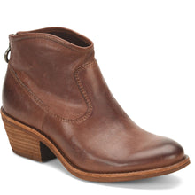 A brown leather ankle boot with a stacked heel