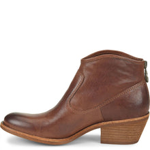 A brown leather ankle boot with a chunky block heel