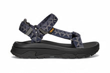 Blue patterned sandal with a black sole 