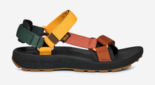 Multicolored sandal with black sole on a white background