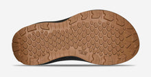 Close-up of a brown shoe sole with tread pattern 