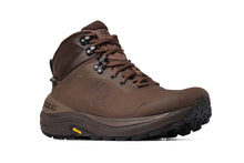 A brown mid-cut hiking boot with a rugged black and brown sole, featuring a visible Vibram