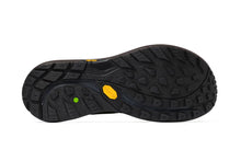 The outsole of a black Vibram shoe